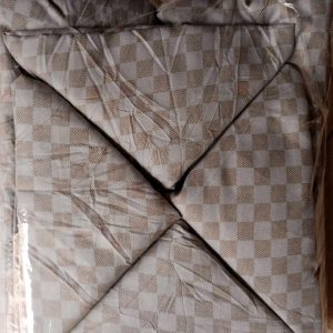 bedspread and 2 pillows